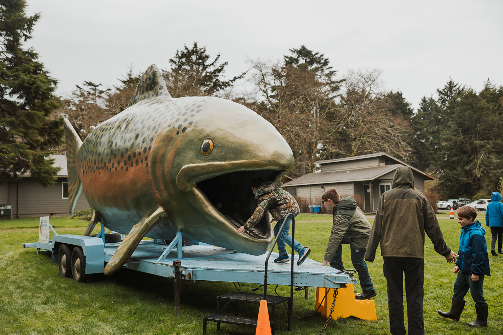 student climbing into the giant chinook's mouth